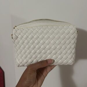 White woven crossbody purse with gold hardware and two straps